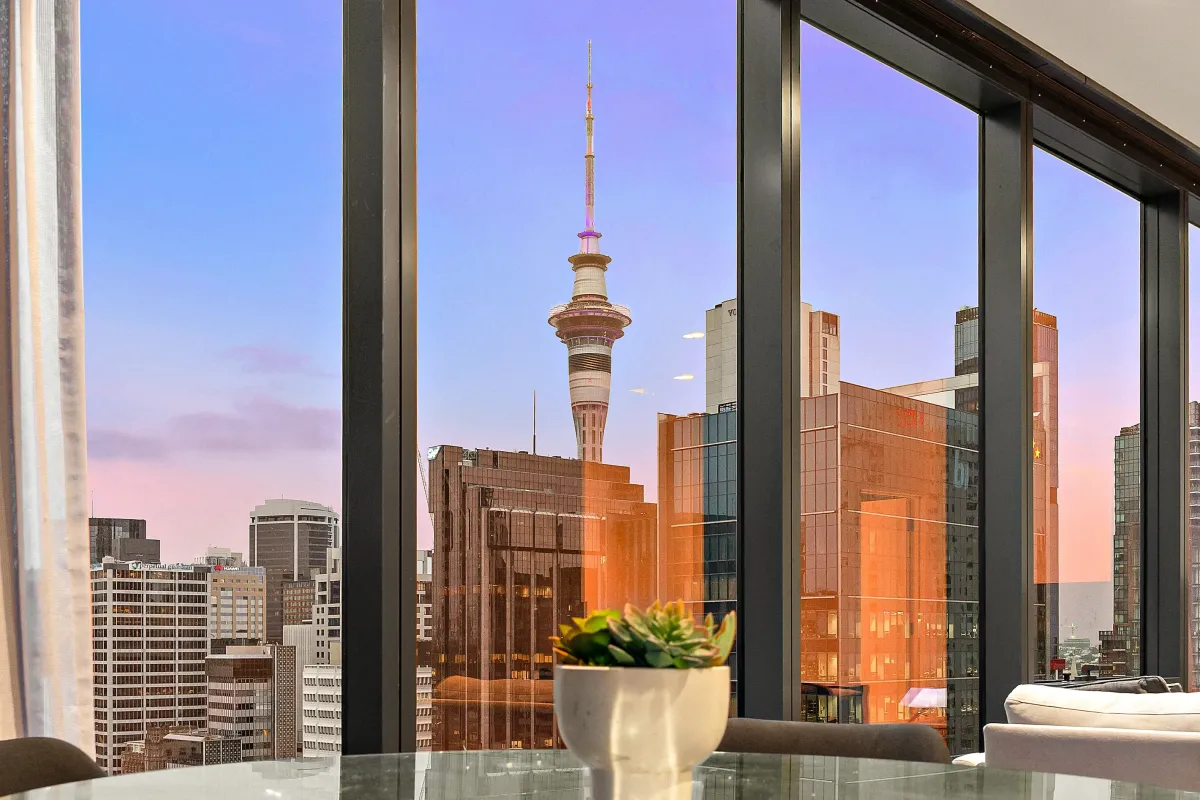 Auckland CBD apartment with a Sky Tower view at dusk